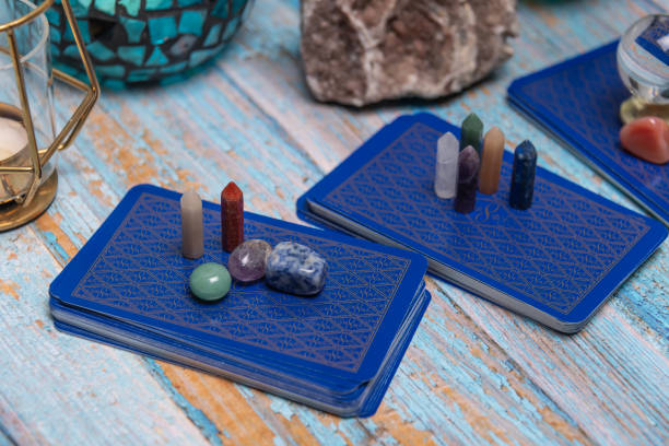 istock An intimate tarot reading session arrangement featuring vibrant crystals, tarot cards, and a geode on a rustic wooden table. 2115672450