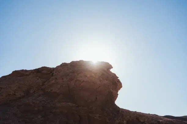 Photo of Back lit shot of arid rock formations in Atacama, Chile