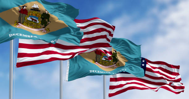 istock Delaware state flag waving with the national american fla 2115760834