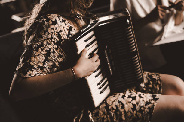 istock Woman playing the accordion. 2115771741