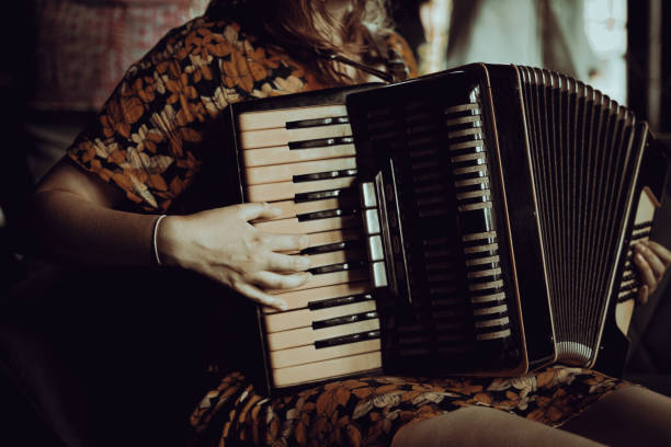 istock Woman playing the accordion. 2115778495