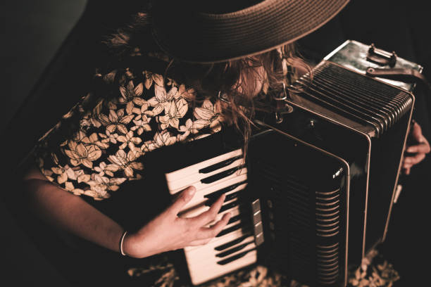 istock Woman playing the accordion. 2115783153