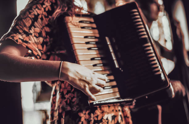 istock Woman playing the accordion. 2115783155