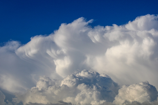 a large cloud that is in the sky. cumulus clouds. cumulonimbus