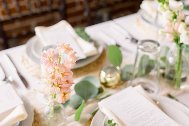 istock An elegant dining table decorated with fresh flowers and greenery 2115822817