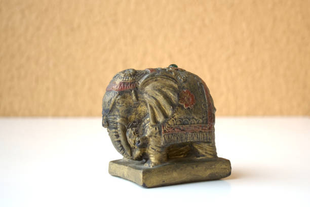 istock Antique Indian elephant statue figure on white table 2115824872