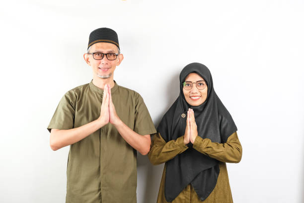 istock Asian Moslem Couple with greetings 2115827929
