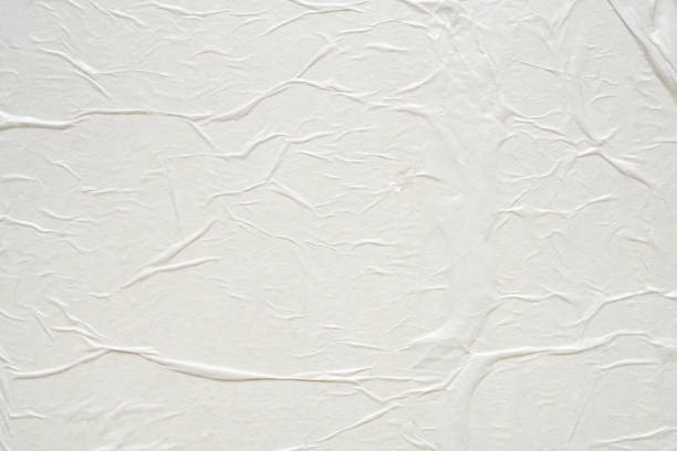 istock White blank crumpled and creased paper poster texture background 2115845805