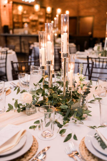 istock Elegant wedding reception details with candlesticks and a beautiful greenery centerpieces 2115853343
