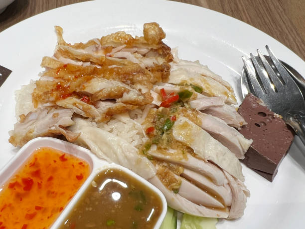 istock crispy chicken with boiled chicken on hot rice 2115906729
