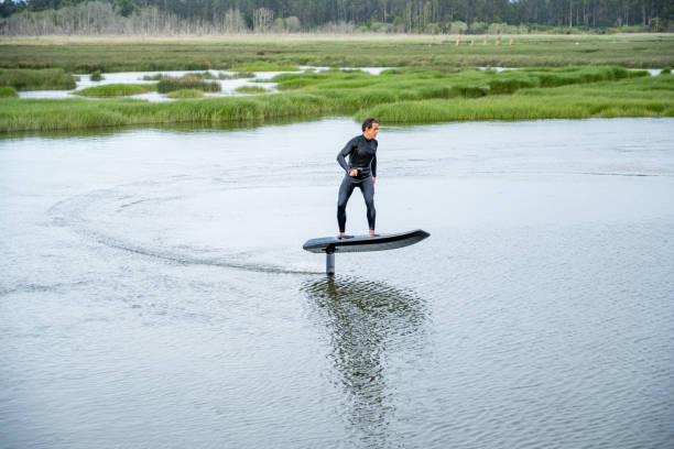 istock Hydrofoil rider gliding over the water 2115910871