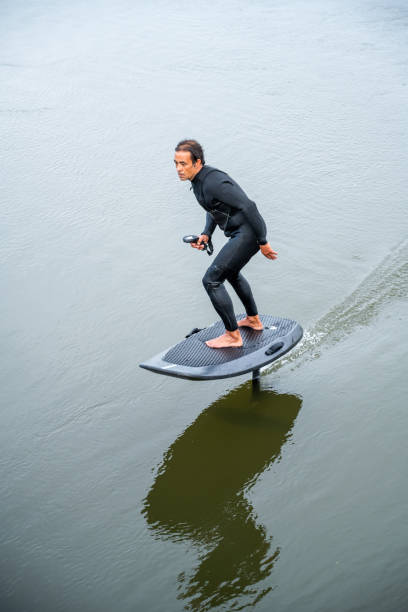 istock Hydrofoil rider gliding over the water 2115912944