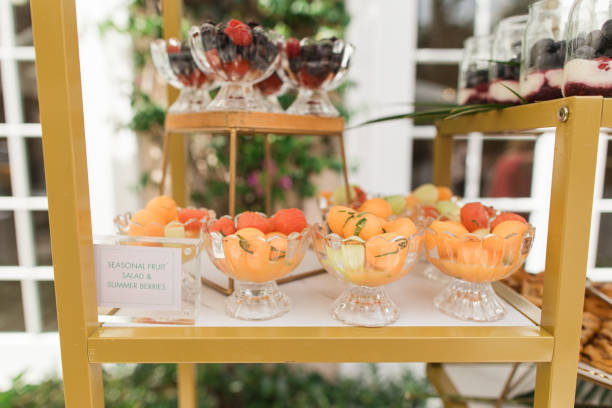 fruit & brunch horderves on display at a spring garden party in palm beach, florida in march of 2024 - spring decoration orange series foto e immagini stock