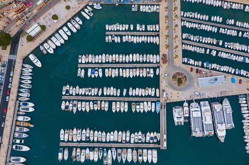 Breathtaking Aerial Perspective of the Mediterranean Sea Harbor, Overflowing with Magnificent Luxury Yachts at the Bustling Marina Docks, Port de SÃ³ller, Balearic Islands, Mallorca, Spain.
