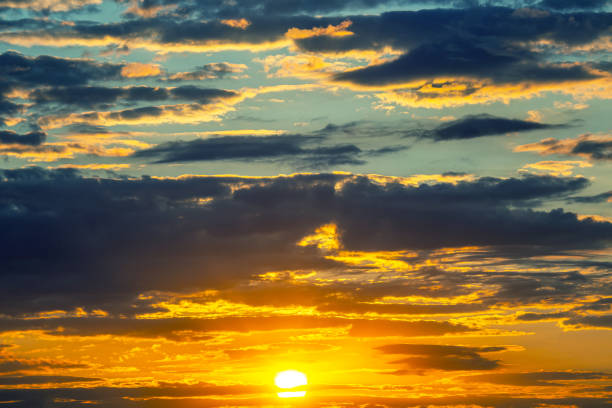 brightly colorful clouds in the evening sky. Lush colored clouds in the sky before sunset. dawn in the clouds