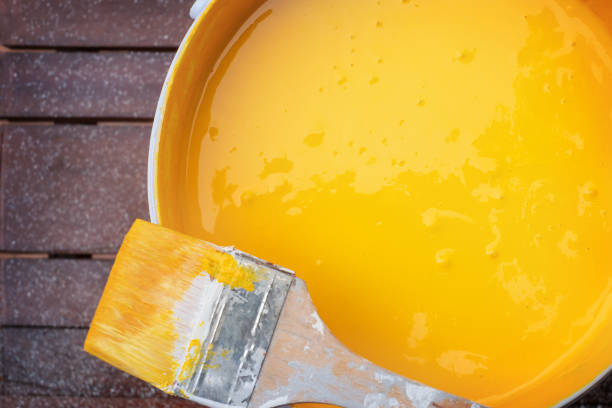 istock Brush on a can of yellow paint 2116066206
