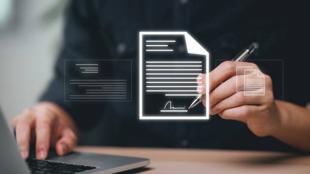 istock Electronic Signing Businessman signs electronic documents on digital documents on virtual laptop screen, Electronic Signature Concept. 2116113495