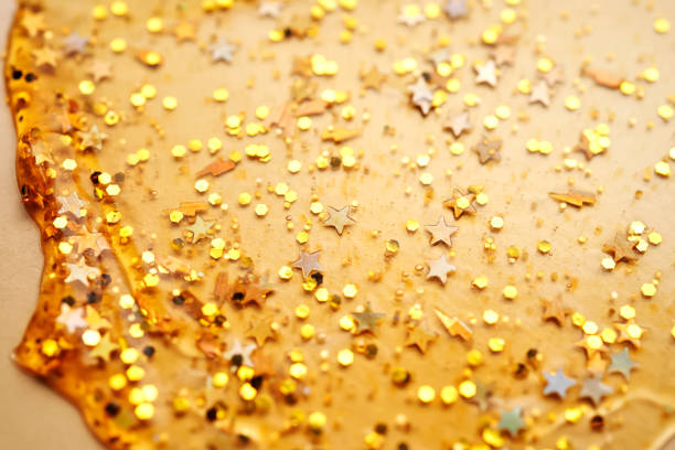 Cosmetic gel with glitter on a beige background. High quality photo.