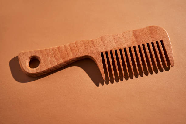istock Wooden comb on a beige background. 2116212799