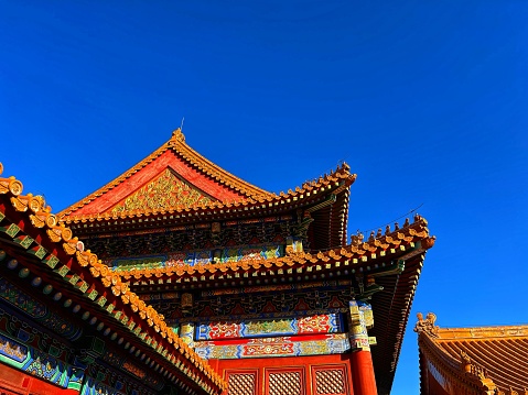 Beijing, China – January 07, 2024: Vibrant building adorned with statues and red trim