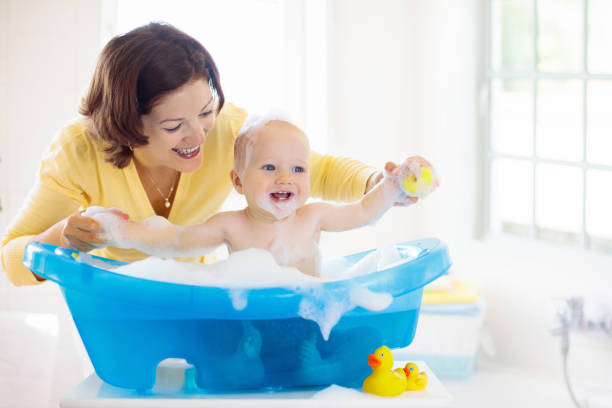 istock Mother and baby in bath 2116341212