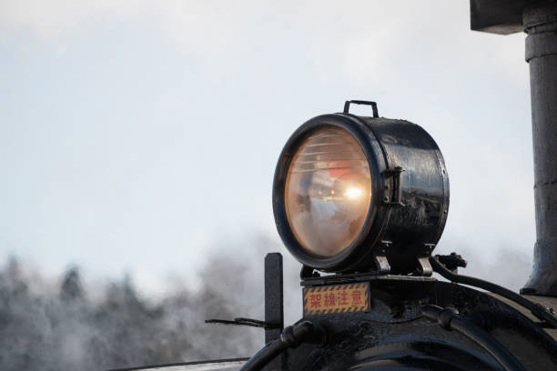Feb 08, 2024 Shibecha, Hokkaido, Japan\nClose up of a lamp on the front of a steam train. Japanese text: