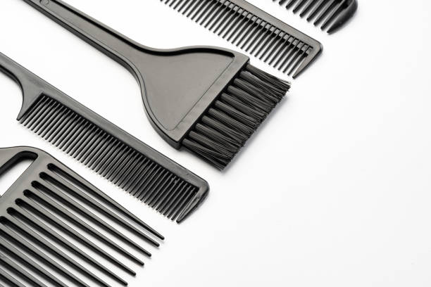 Black plastic hair comb isolated on white background close up