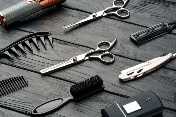 istock Professional Barber Tools Laid Out on Dark Wooden Surface 2116481282