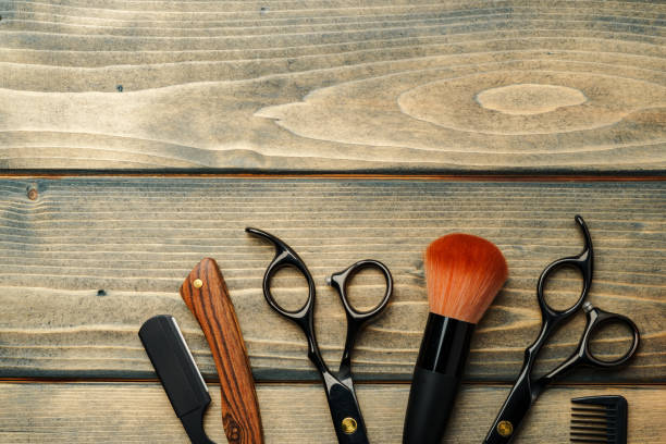 istock Set of professional barber tools on wooden table 2116497288