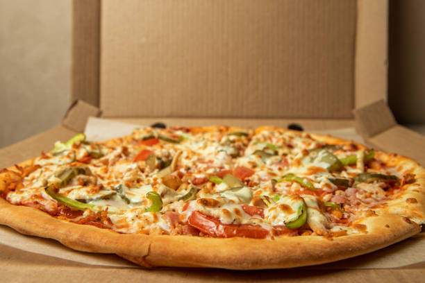 istock pizza on the table close-up selected focus 2116497293