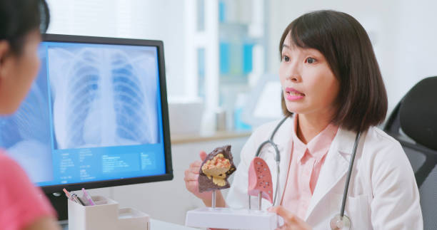 istock asian doctor explain lung illness 2116504663