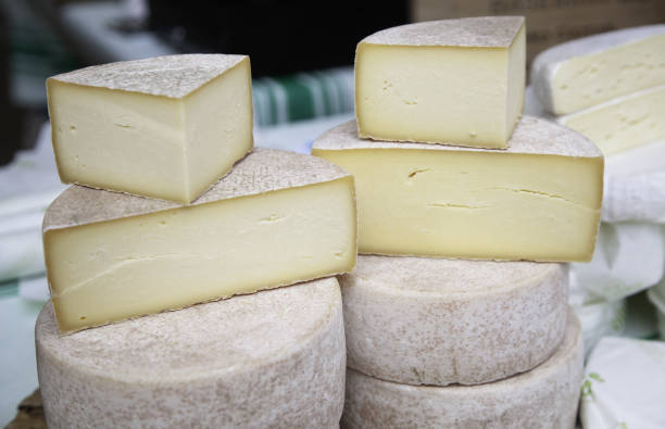 istock Pieces of cheese in a market 2116505708