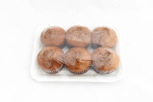 istock Muffins cakes package on white isolated background 2116524047
