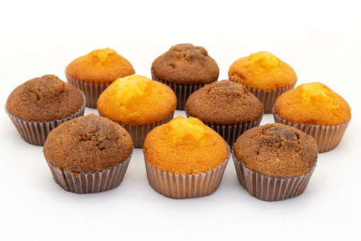 Muffins cupcake on white background. Top view with selective focus.