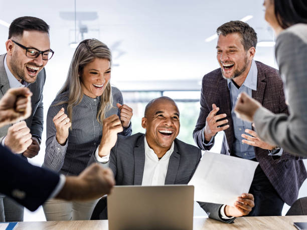 istock Celebrating good news in the office! 2116547048
