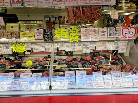 Butcher market stall at the weekly market in Strasbourg. Captured during spring season.