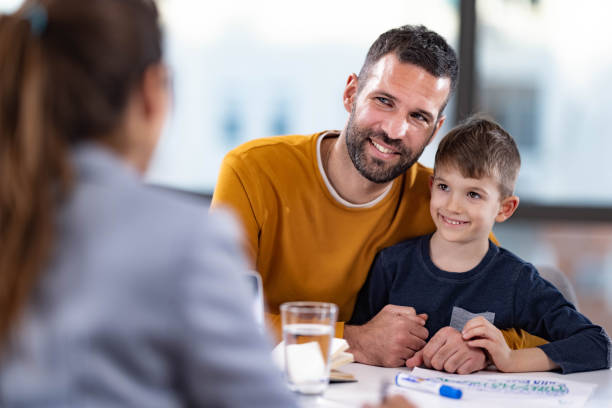 istock Happy single father and his son having a counseling session. 2116552340