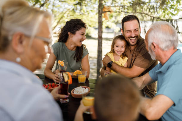 istock Happy extended family enjoying a day on a patio. 2116553087
