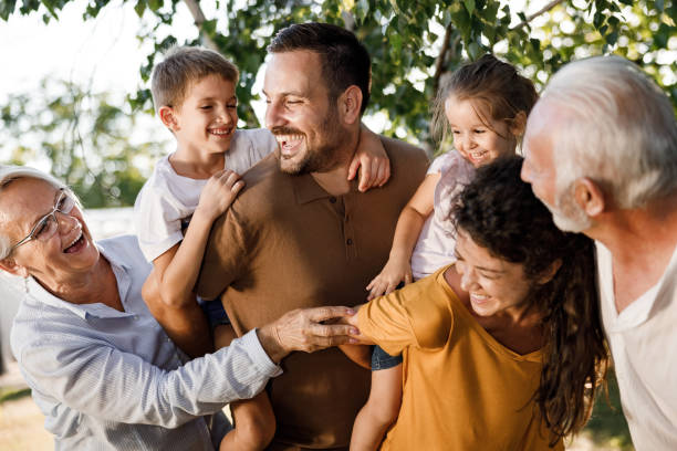 istock Cheerful extended family having fun in nature. 2116554725