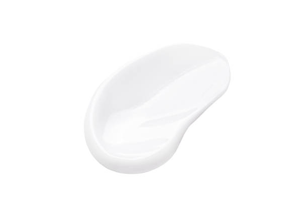 istock cosmetic sample smear of cream on white background 2116572087