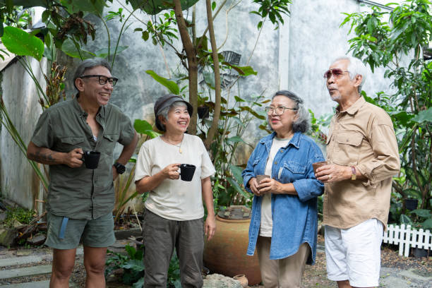 istock Asian senior talking at garden 2116596670
