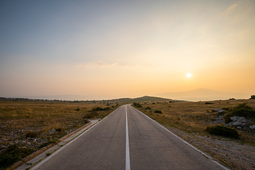 Road in the background with sunset, mountain Svilaja Croatia.