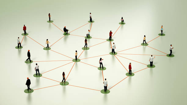 istock Miniature Figures Positioned on a White Surface Depicting Network Connections 2116673211