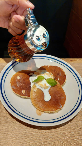 istock Homemade buttermilk pancake served with fresh honey. 2116678949