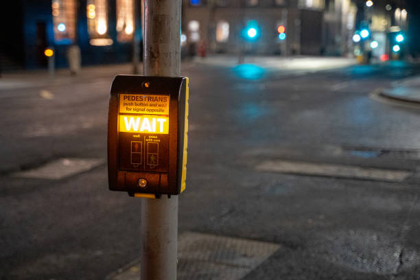 istock Wait sign illuminated at pedestrian crossing 2116690132