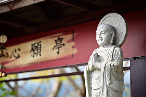 Taiwan - Feb 17, 2024: \nClose-Up of Ksitigarbha Bodhisattva with Folded Hands. The gesture symbolizes devotion, respect, compassion, and salvation for sentient beings.