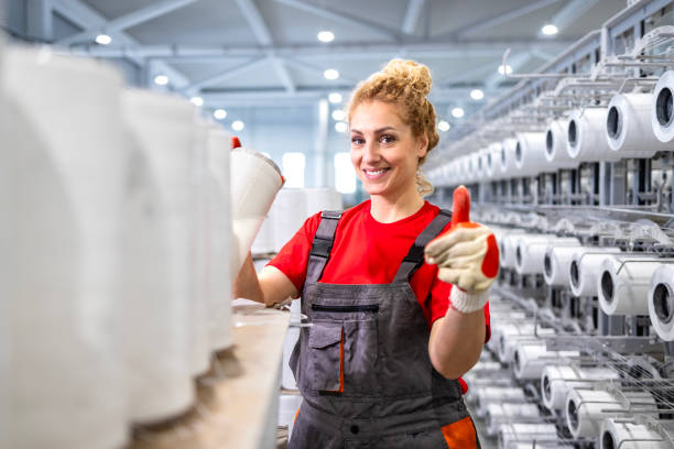 istock Production line worker in textile factory. 2116773773