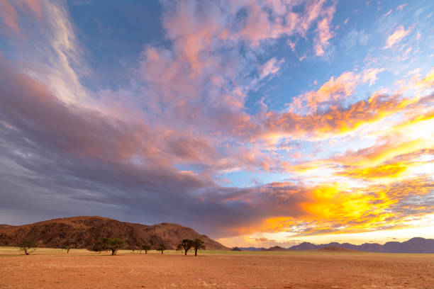 istock Yellow blue and pink clouds at sunset 2116776888