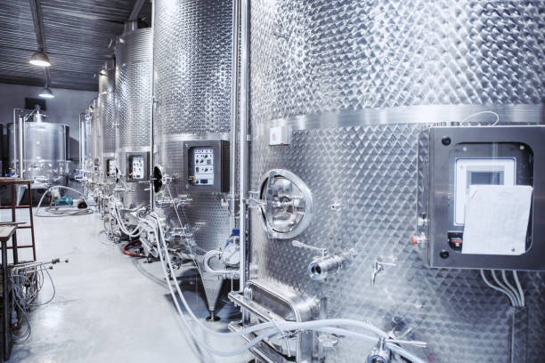 istock Stainless Steel Containers for Alcoholic Fermentation in a Wine Production Facility 2116828302