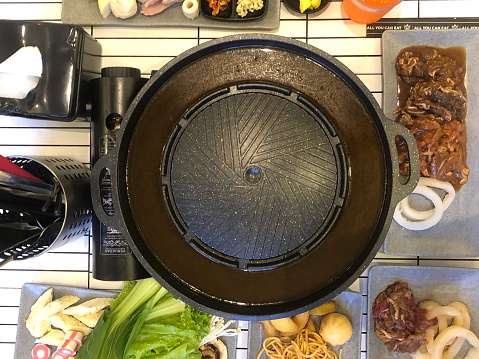 Korean hot pot feast with a mixture of  meats, veggies, and rich broth in one